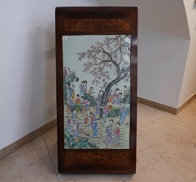 A large Chinese famille rose plaque inset in a wooden table, Republic, 20th C.