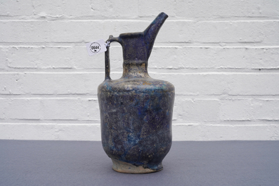 A blue-glazed Islamic pottery jug, Kashan, Iran, 13th C.