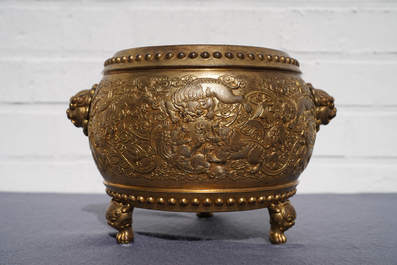 A Chinese gilt bronze tripod censer with buddhist lions, Qianlong mark, 19/20th C.