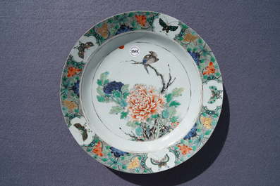 A Chinese famille verte charger with a bird, flowers and butterflies, Kangxi