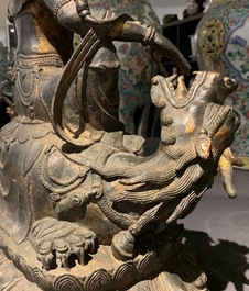 A large Chinese bronze group of Guanyin on a dragon, prob. Ming