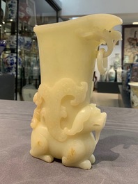 A Chinese yellow jade rhyton cup, 19/20th C.