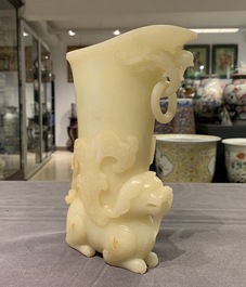 A Chinese yellow jade rhyton cup, 19/20th C.