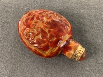 A Chinese carved realgar glass snuff bottle, Imperial Glassworks, Beijing, 1730-1840