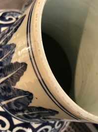 A pair of Chinese blue and white vases and covers with floral sprigs, 19th C.