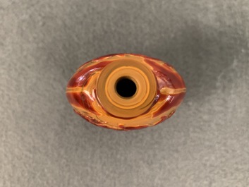 A Chinese carved realgar glass snuff bottle, Imperial Glassworks, Beijing, 1730-1840