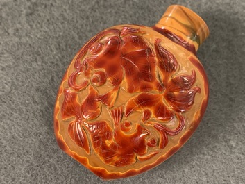 A Chinese carved realgar glass snuff bottle, Imperial Glassworks, Beijing, 1730-1840