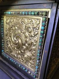 A turquoise-inlaid gilt bronze and copper repouss&eacute; 'tepchog' folding altar table, Tibet, 19th C.