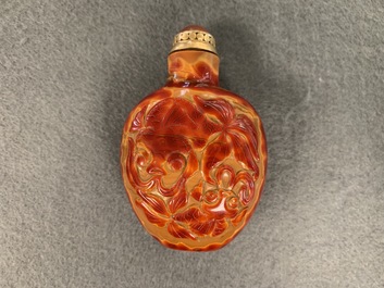 A Chinese carved realgar glass snuff bottle, Imperial Glassworks, Beijing, 1730-1840