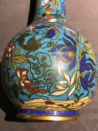 A Chinese cloisonn&eacute; bottle vase and a gilt bronze group, 18/19th C.