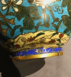 A Chinese cloisonn&eacute; bottle vase and a gilt bronze group, 18/19th C.