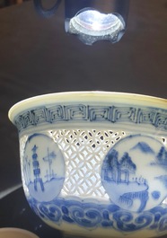 A Chinese blue and white reticulated bowl with landscape panels, Transitional period