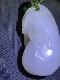 A Chinese white jade pendant of a monkey on a pouch, Qing