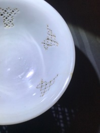 A Chinese blue and white reticulated double-walled teapot and two bowls, Transitional period