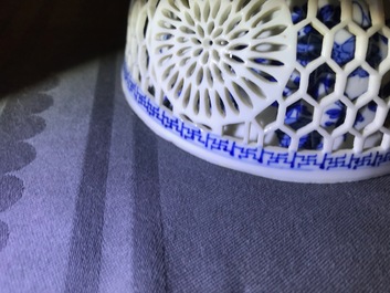 A Chinese blue and white reticulated double-walled teapot and two bowls, Transitional period