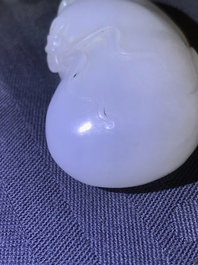 A Chinese white jade pendant of a monkey on a pouch, Qing