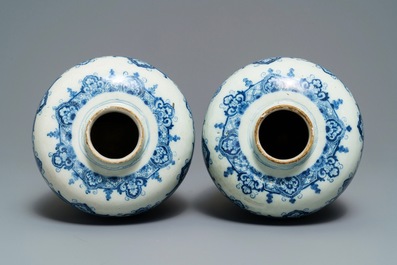 A pair of Dutch Delft blue and white Daniel Marot style vases, early 18th C.