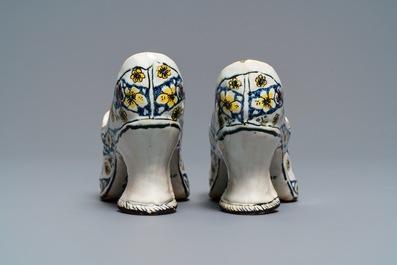 A pair of polychrome French faience lady's shoes, Lille, dated 1751