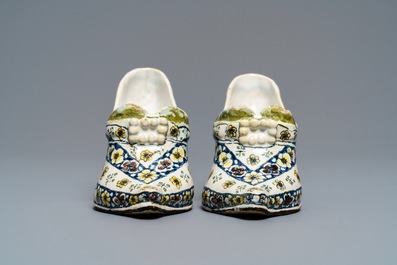 A pair of polychrome French faience lady's shoes, Lille, dated 1751