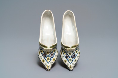 A pair of polychrome French faience lady's shoes, Lille, dated 1751