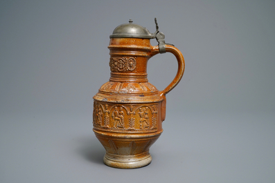 A 'Peasants dance' stoneware jug with pewter lid, Raeren, dated 1578