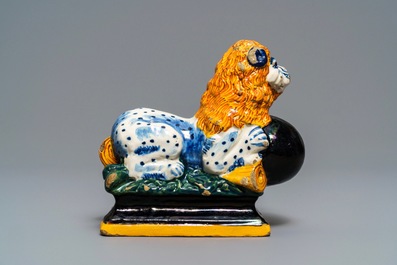 A black-enhanced polychrome Dutch Delft model of a lion, 1st half 18th C.