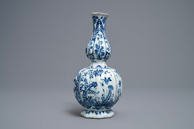 A ribbed Dutch Delft blue and white double gourd vase, early 18th C.