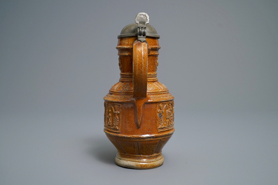 A 'Peasants dance' stoneware jug with pewter lid, Raeren, dated 1578