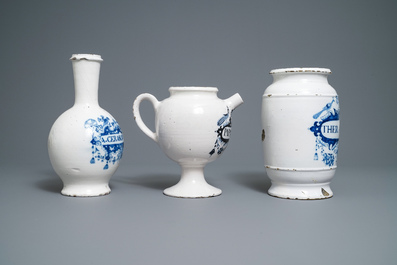 A large Dutch Delft blue and white albarello, a wet drug jar and a Brussels faience bottle, 18th C.