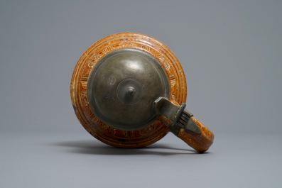 A 'Peasants dance' stoneware jug with pewter lid, Raeren, dated 1578