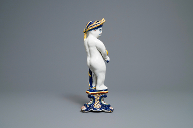 A polychrome Dutch Delft model of a boy, allegory of spring, 18th C.