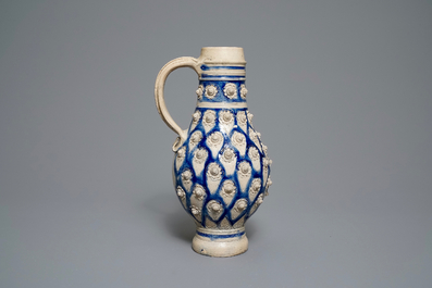 A large German stoneware jug with applied floral design, Westerwald, 17th C.