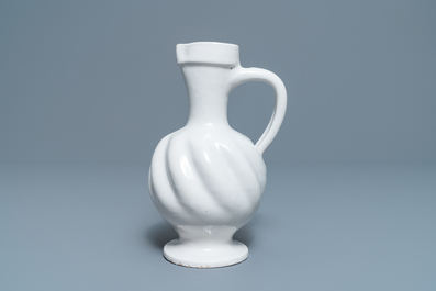 A white Dutch Delft gadrooned jug, 17th C.