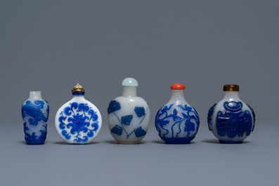 Nine various Chinese blue overlay and transparent glass snuff bottles, 19/20th C.