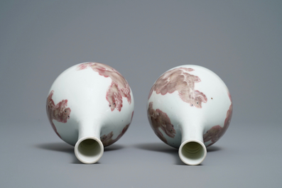 A pair of Chinese copper red 'mythical beasts' vases, Kangxi