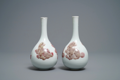 A pair of Chinese copper red 'mythical beasts' vases, Kangxi