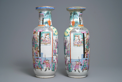 A pair of of Chinese famille rose rouleau 'court scene' vases, 19th C.