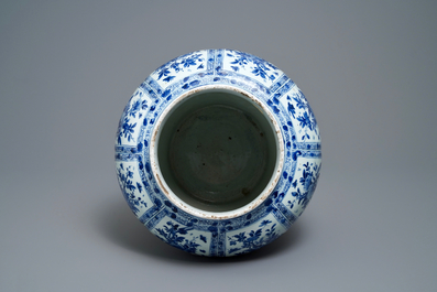 A large Chinese blue and white baluster jar with wooden cover and stand, kangxi