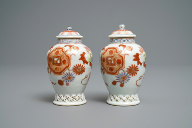 A pair of Chinese iron red and gilt tea caddies and covers, Yongzheng
