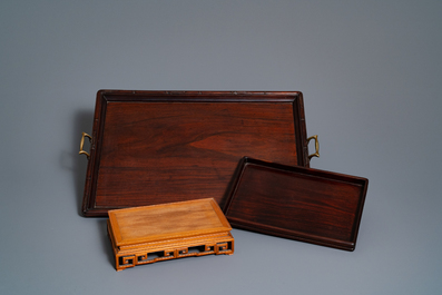 Two Chinese carved wooden trays and a stand, 18/19th C.