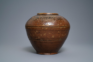 A Chinese brown-glazed cizhou jar with incised design, Yuan