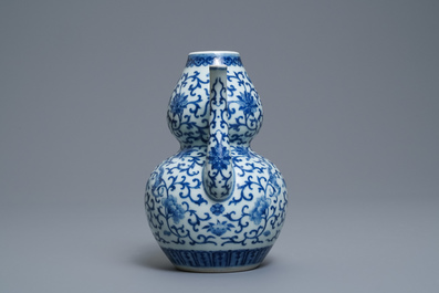 A Chinese blue and white 'bats and shou' jug, 19th C.