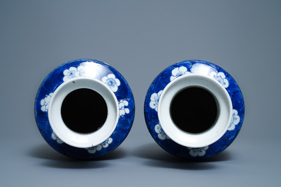 A pair of Chinese blue and white rouleau vases with figures near an elephant, Kangxi mark, 19th C.