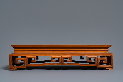 Two Chinese carved wooden trays and a stand, 18/19th C.