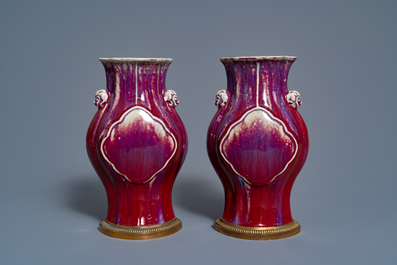 A pair of Chinese flamb&eacute;-glazed vases on gilt bronze stands, 18/19th C.