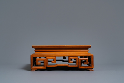 Two Chinese carved wooden trays and a stand, 18/19th C.