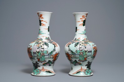 A pair of Chinese famille verte vases with figures on a terrace, Kangxi mark, 19th C.