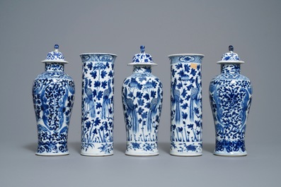 A Chinese blue and white five-piece garniture with peacocks, Kangxi mark, 19th C.