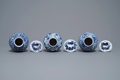 A Chinese blue and white five-piece garniture with peacocks, Kangxi mark, 19th C.