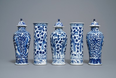 A Chinese blue and white five-piece garniture with peacocks, Kangxi mark, 19th C.